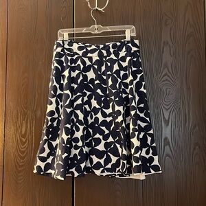 Premise Studio flared white with navy blue patterned skirt. Size 10